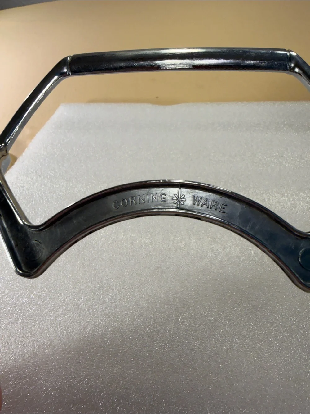 Corning, ware casserole, dish, glass lid, and chrome trivet